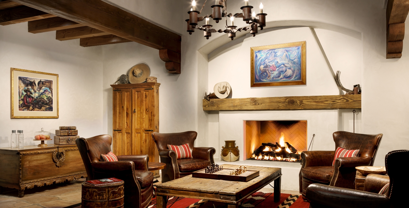 a room with a fireplace and couches