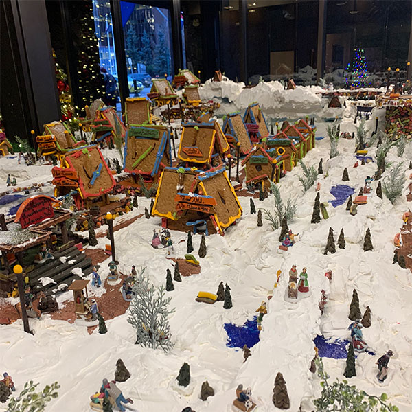 a gingerbread village in the snow