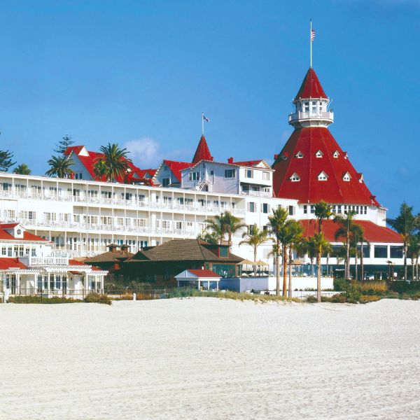 a large white building with red roofs and a red roof
