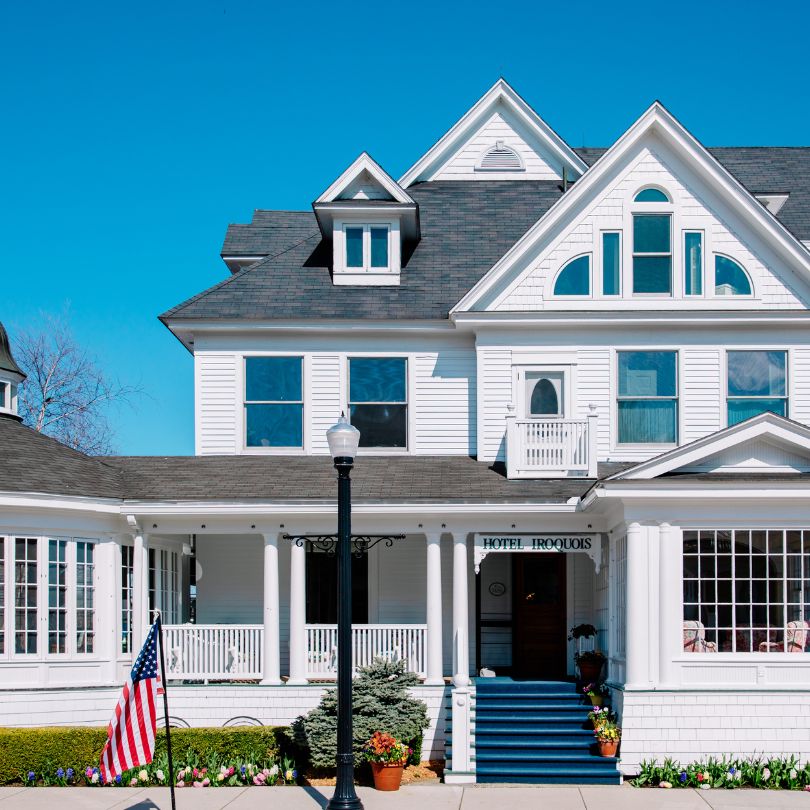 a white house with a flag