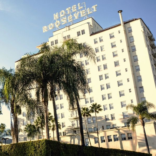 a large white building with a sign on top