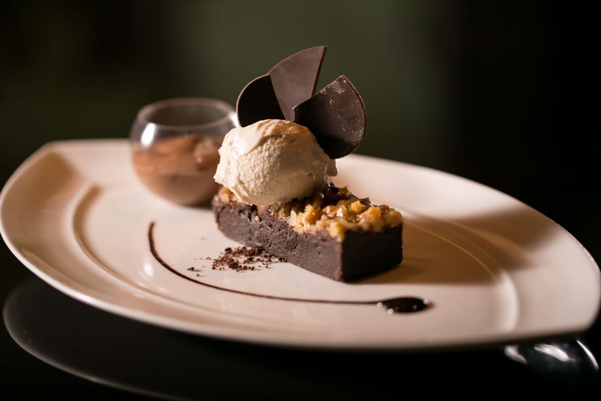 a plate of dessert with a scoop of ice cream on top