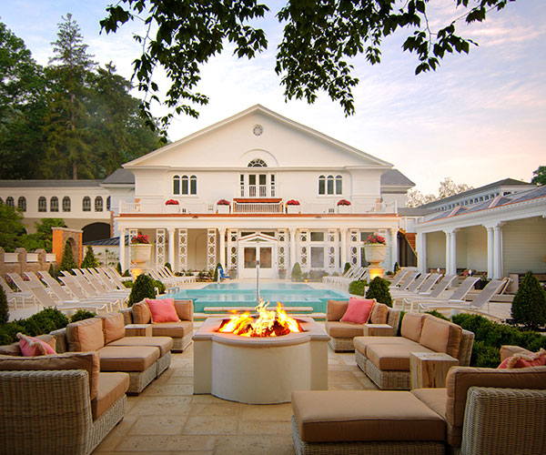 a fire pit with chairs around it