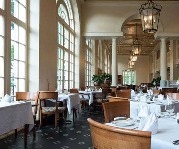 a restaurant with tables and chairs