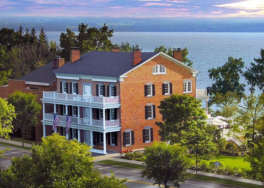 a large brick building with a large body of water