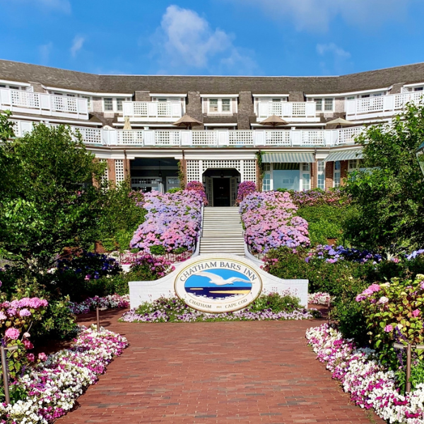 a building with a garden and a sign