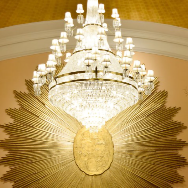 a chandelier with many lights from a wall