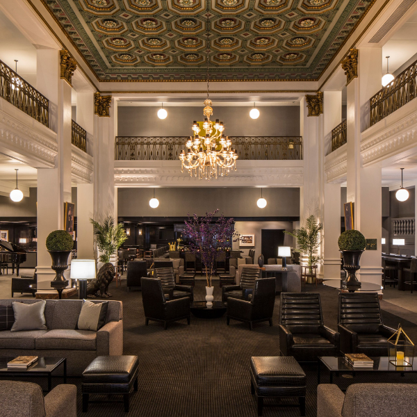 a large room with a chandelier and chairs