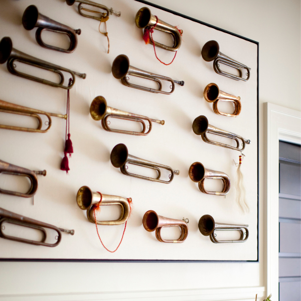 a wall with many trumpets on it