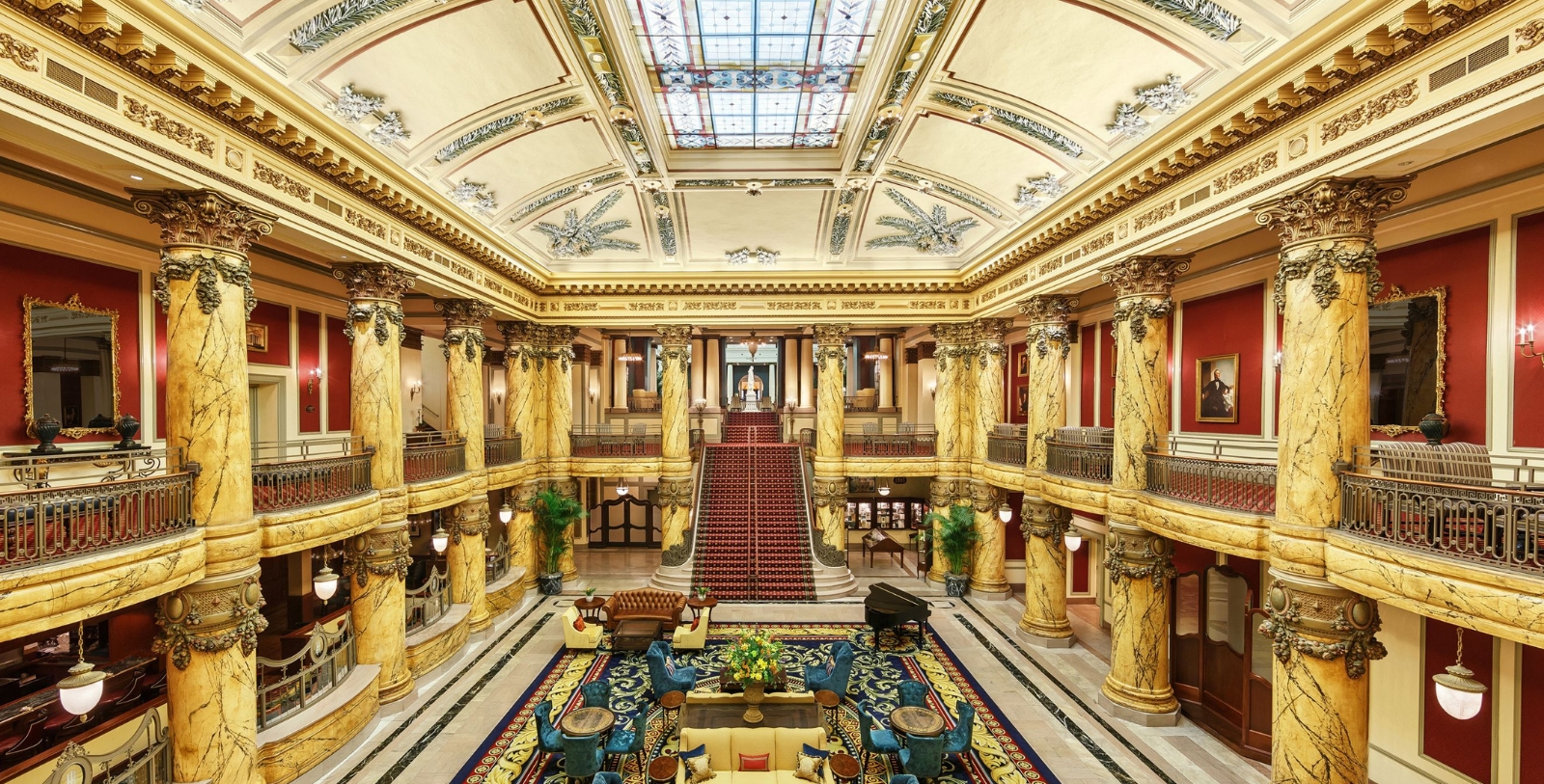 a large building with a staircase and a large carpeted area