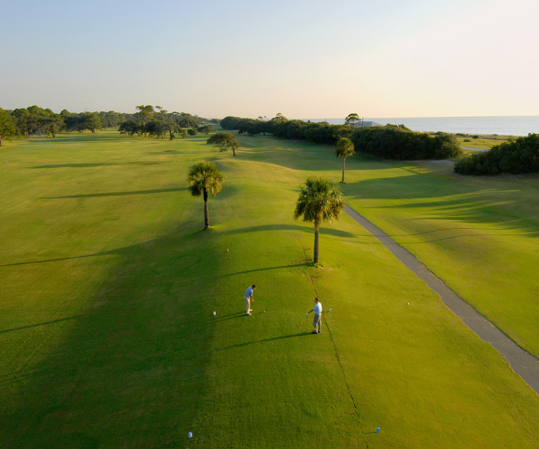 a group of people playing golf