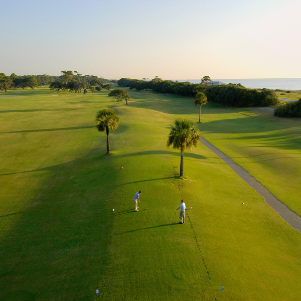 a group of people playing golf