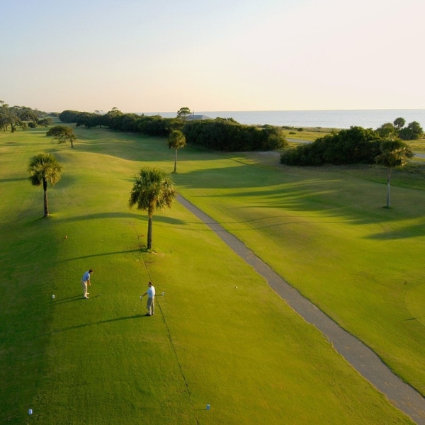 a group of people playing golf