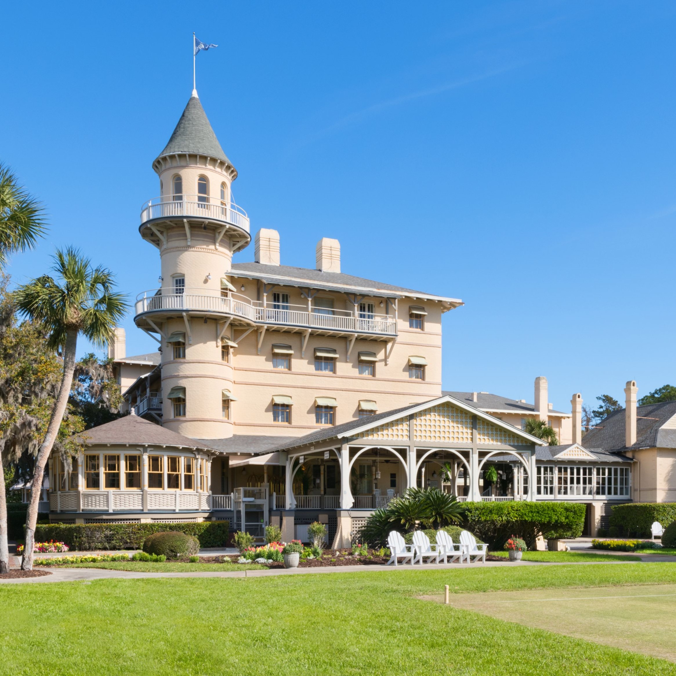 a large building with Jekyll Island and a lawn