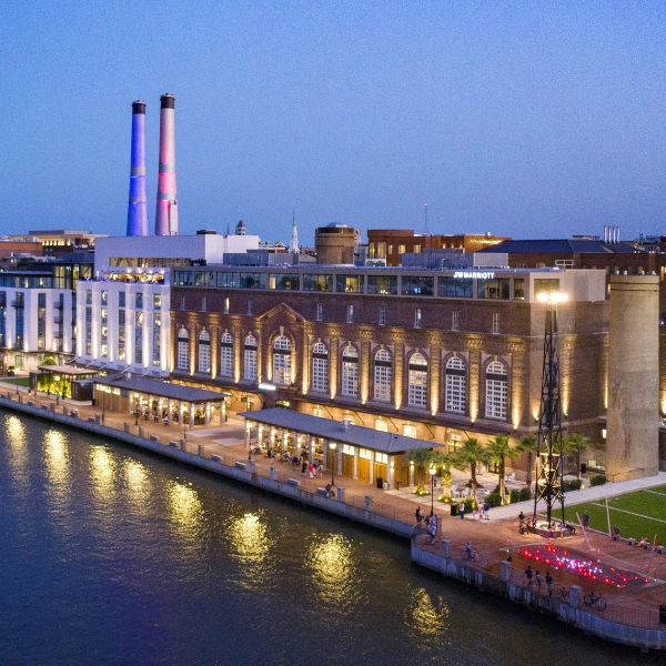 a building next to a body of water