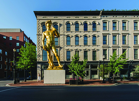 a statue of a man in front of a building 21