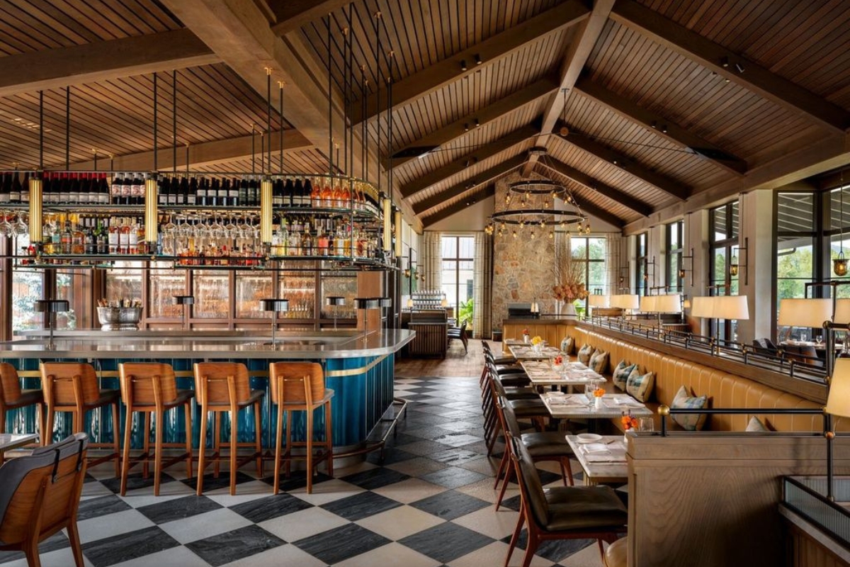a restaurant with a bar and chairs