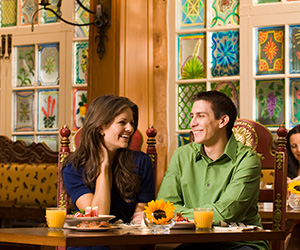 a man and woman sitting at a table