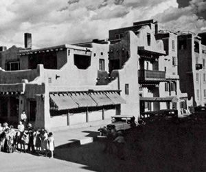 a group of people standing in front of a building