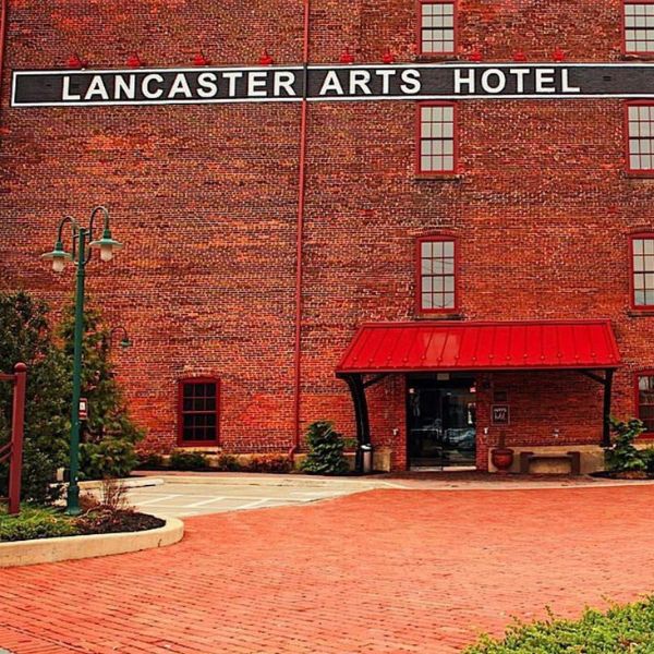 a brick building with a sign on the side