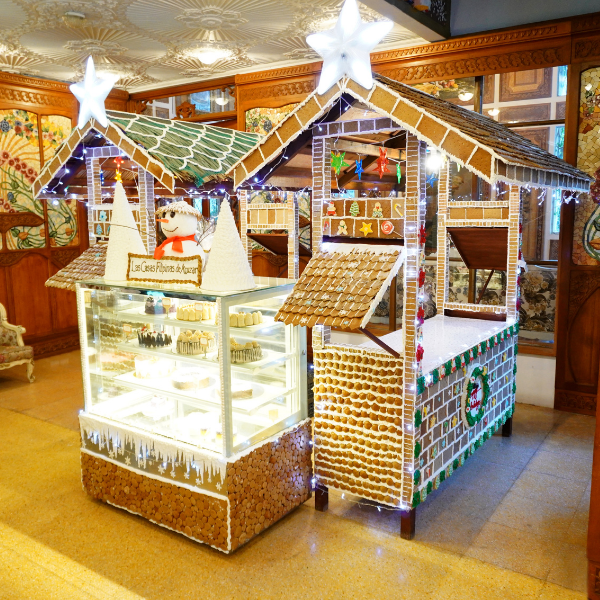 a gingerbread house display with lights