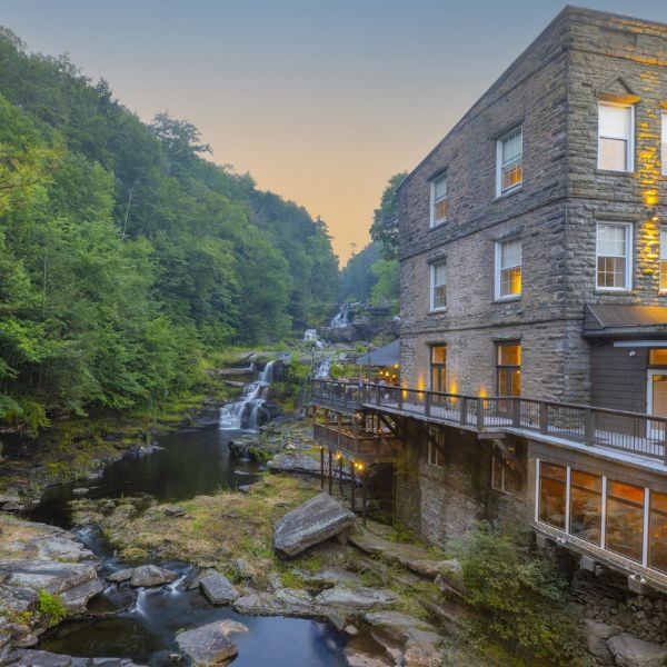 a building with a waterfall in the background