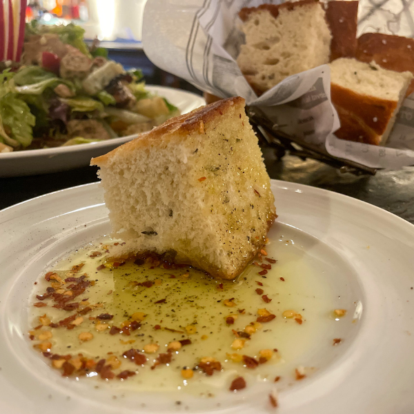 a plate of food with a piece of bread on it