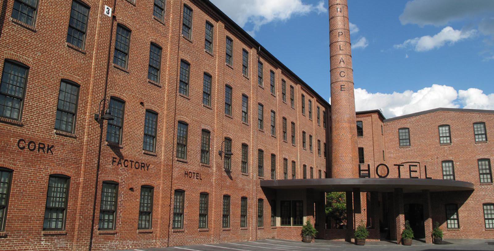 a brick building with a tall chimney