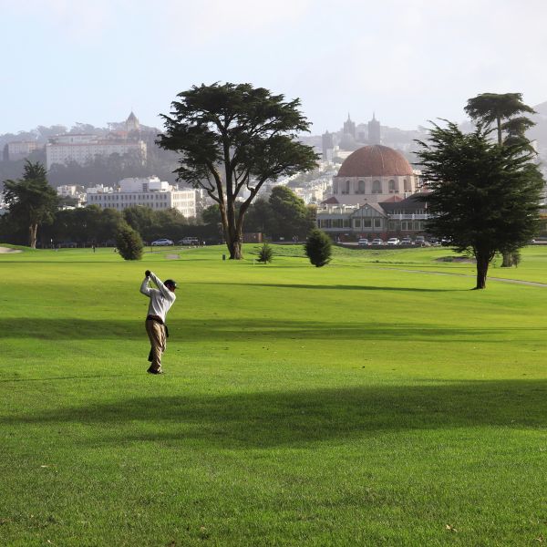 a man swinging a golf club