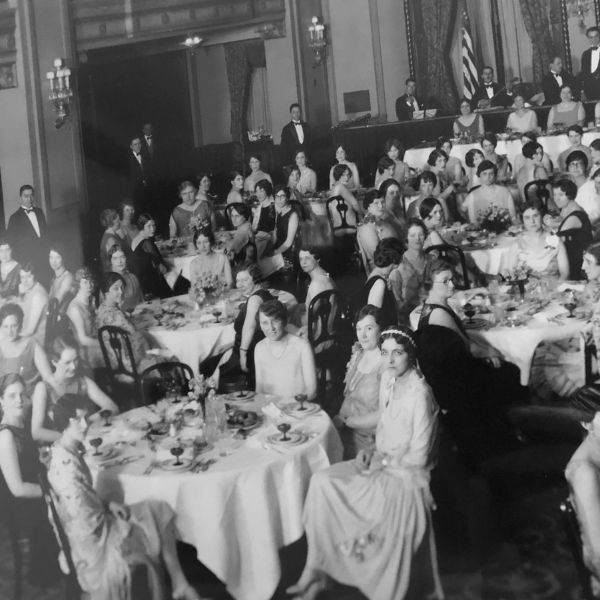 a group of people sitting at tables