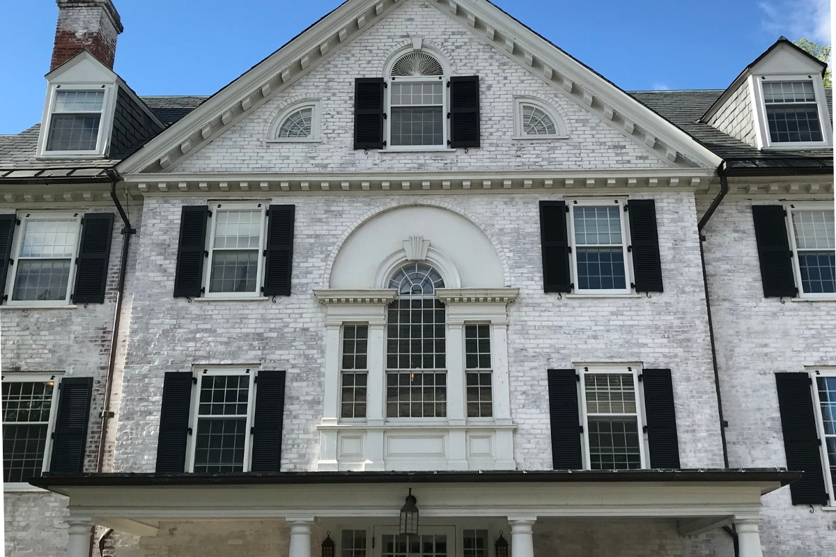 a white house with black shutters 1