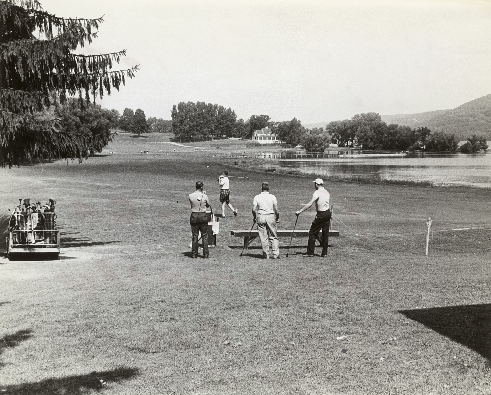 a group of men playing golf
