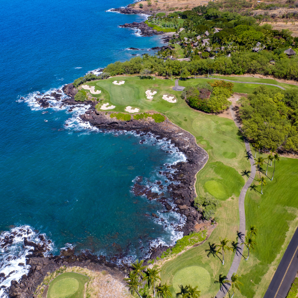 a golf course with a body of water