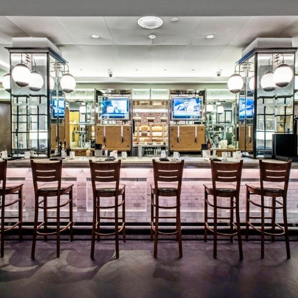 a bar with chairs and a counter
