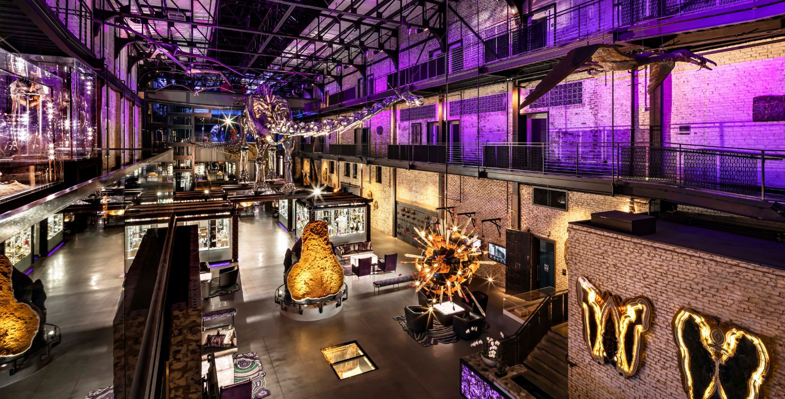 a large room with lights and a large building