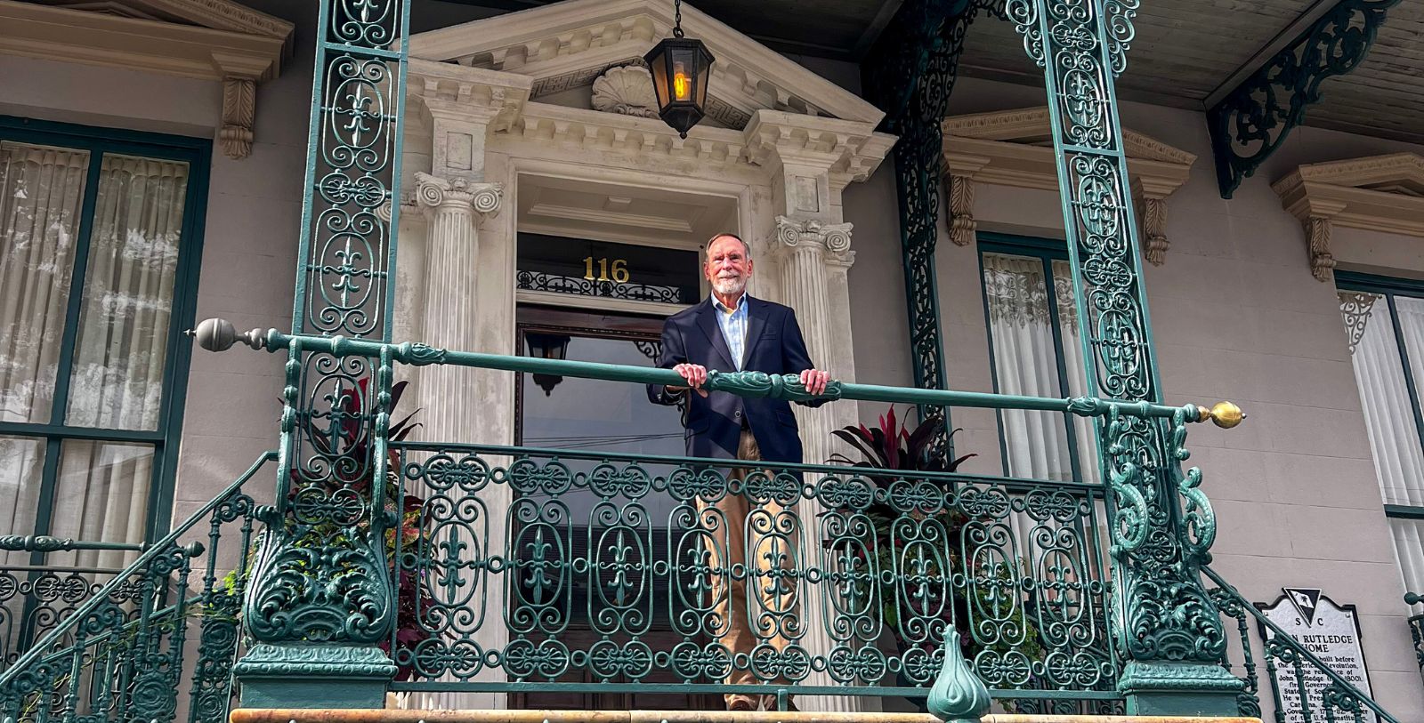 a man standing on a balcony
