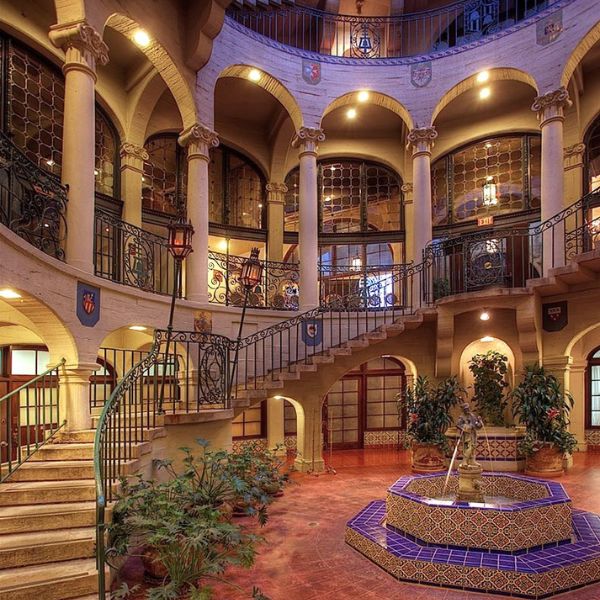 a building with a fountain and stairs