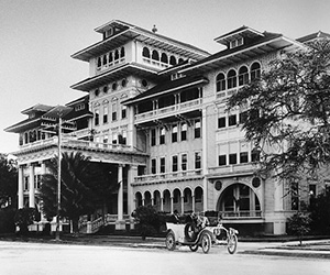 a large building with a horse carriage