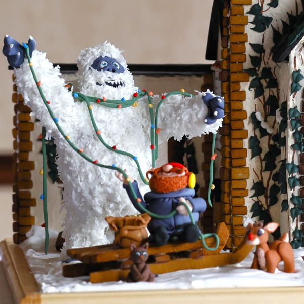 a snowman and a gingerbread house