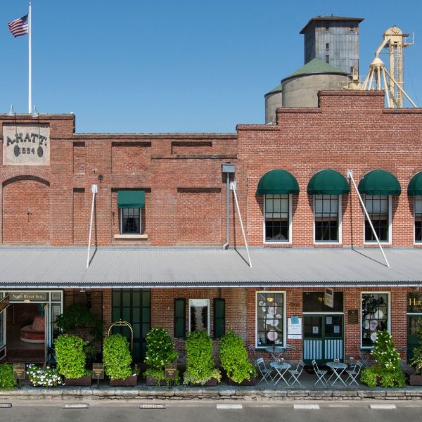 a brick building with a flag on the front