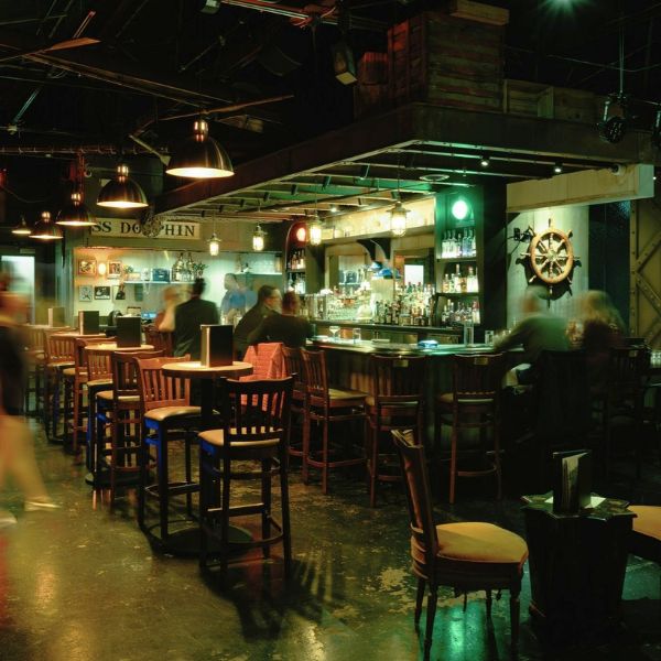 a bar with people in the background