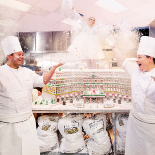 a group of chefs throwing flour in the air