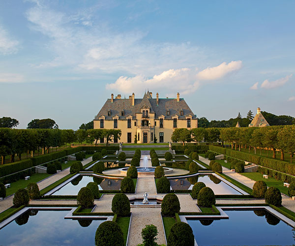 a large mansion with a large garden with Vaux-le-Vicomte in the background