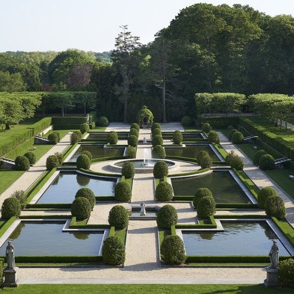 a garden with water and trees