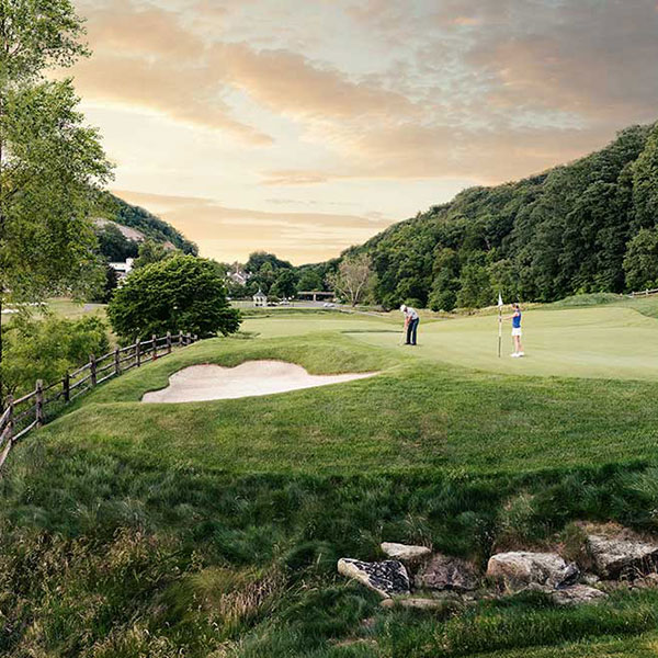 a group of people on a golf course