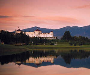 a large building next to a lake