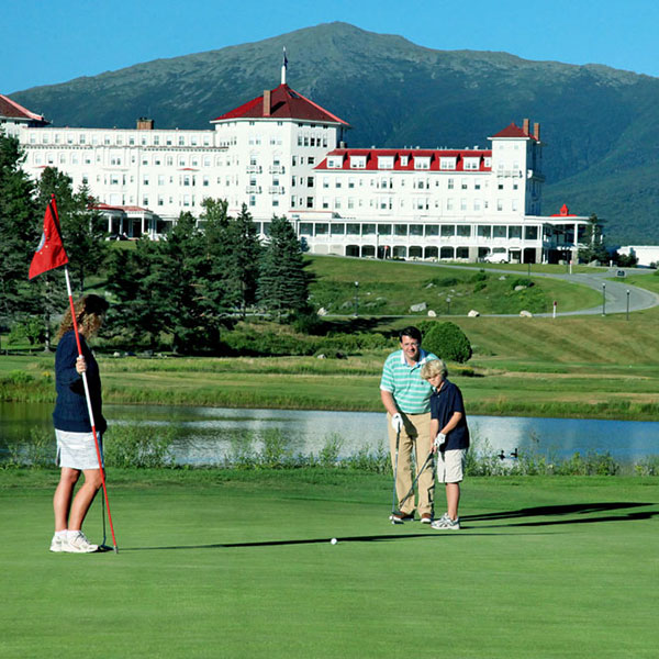 a group of people on a golf course
