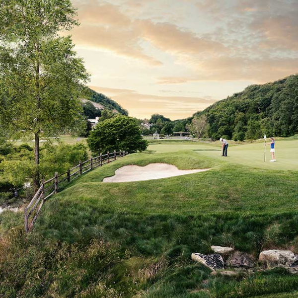 a group of people on a golf course
