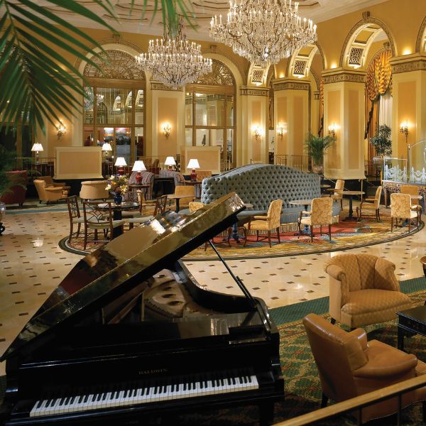 a grand piano in a hotel lobby