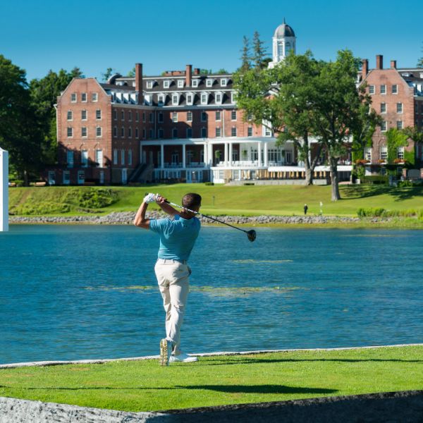 a man swinging a golf club